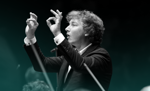 Maxim conducts the Orchestra