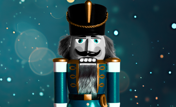 A blue nutcracker soldier is featured with a blue glistening backdrop.