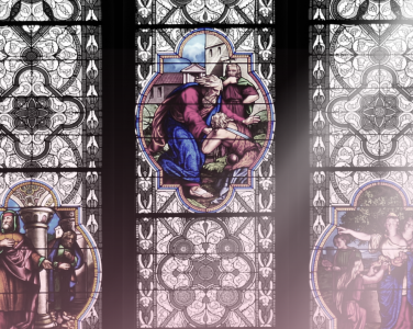 A ray of sun shines over stained glass.