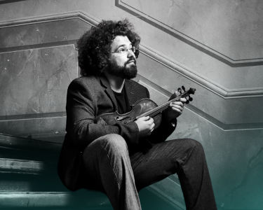 Jonian Ilias-Kadesha shits on some old stairs with a violin.