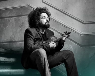 Jonian Ilias-Kadesha shits on some old stairs with a violin.