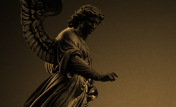 An angel statue with a golden hue.