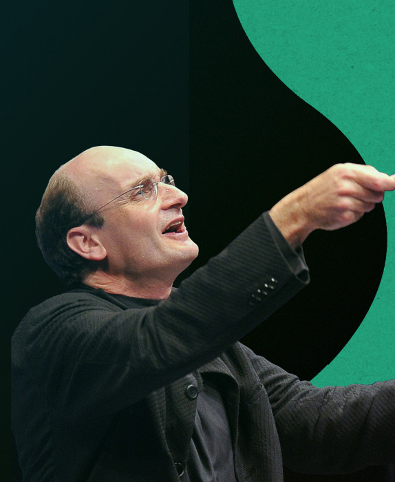 Andrew Manze, conducting with the baton raised high, against a vibrant background with bright and dark green tones.