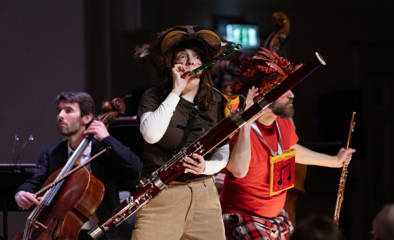 Cerys holds her bassoon in character as the Gaboon.