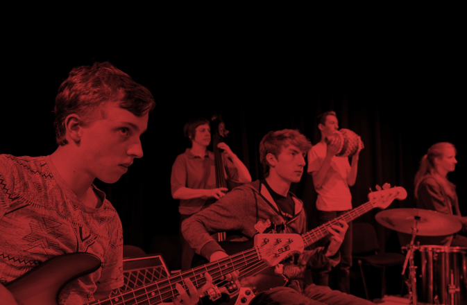 Young Musicians play as part of VIBE. There is a black and red effect on the image.