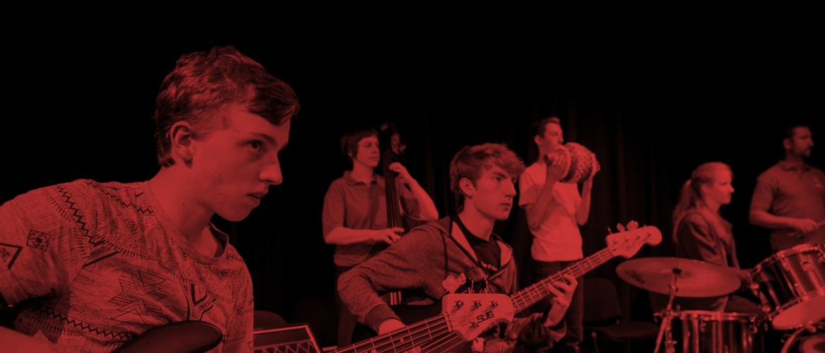 Young Musicians play as part of VIBE. There is a black and red effect on the image.