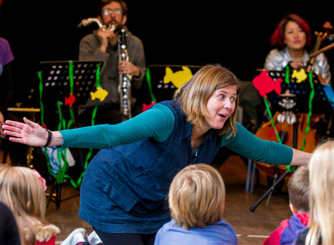 SCO Violin Aisling O'Dea performing in front of a group of children.