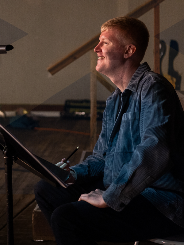 Jay sits admiring the filming of his work