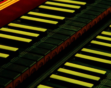 A vibrant close up image of an organ's keys.