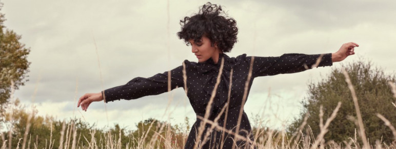 ANOUSHKA SHANKAR dancing in a field